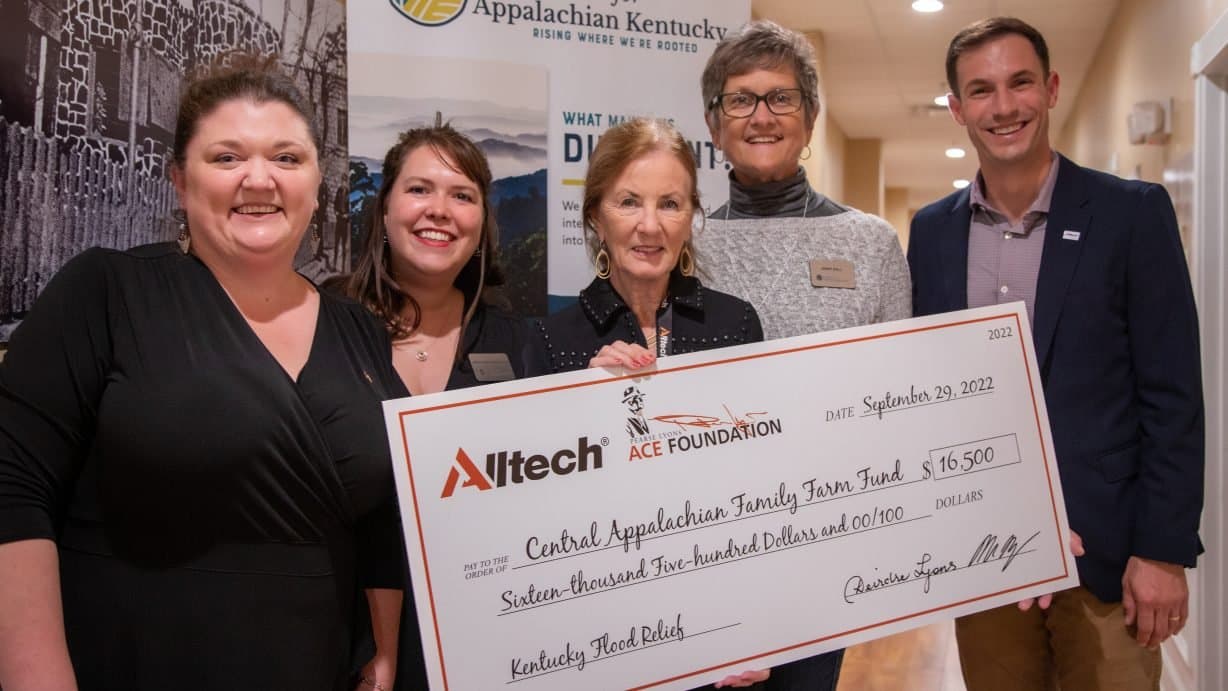 Foundation representatives presenting flood relief funding